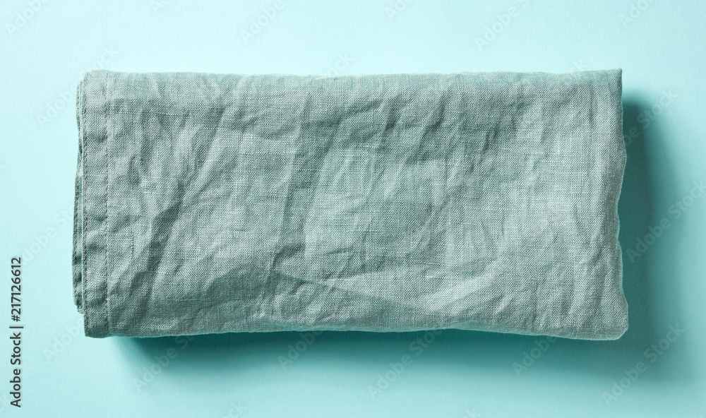Cotton napkin on blue, from above Cotton napkin on blue, from above