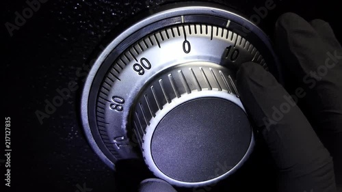 Rotating the safe with hand glove black.