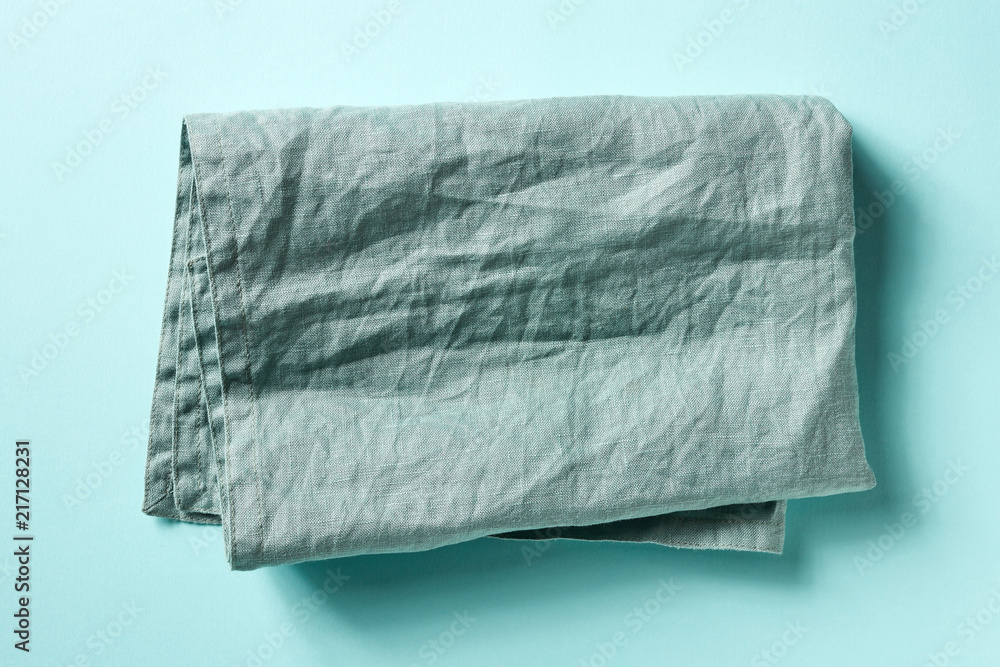 Cotton napkin on blue, from above Cotton napkin on blue, from above