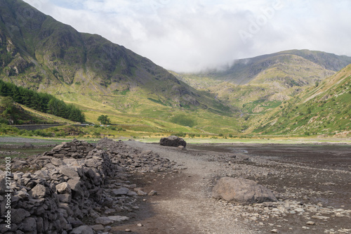 Low Water levels at Haweswater reservoir, Cumbria in summer 2018 revewal the old walls of the village of Mardale Green
