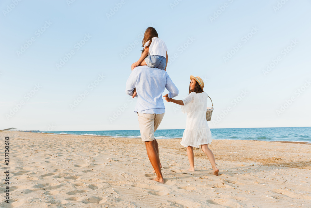 Happy family having fun together at the beach. Happy family having fun together at the beach.