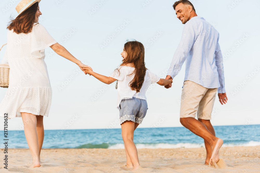 Happy family having fun together at the beach. Happy family having fun together at the beach.