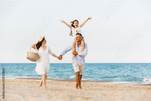 Happy family having fun together at the beach.