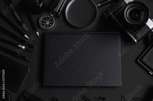 Set of black identity elements on black paper background. Black branding mockup photo