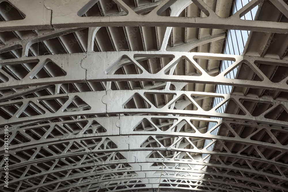 Old arched metal structure. Industrial geometry.