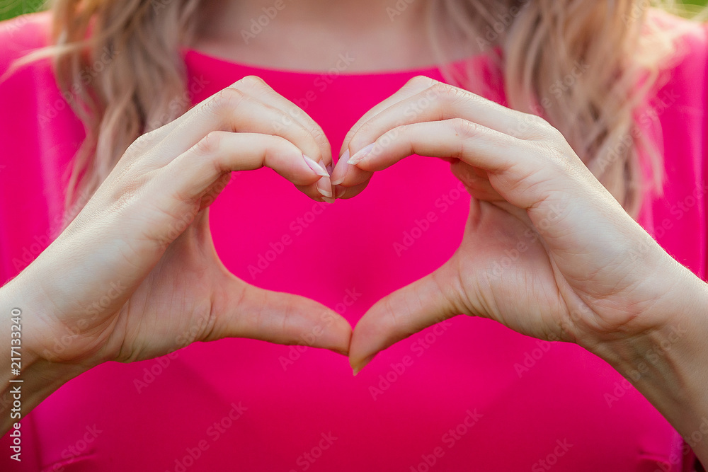 female heart-shaped fingers close-up Valentine's Day