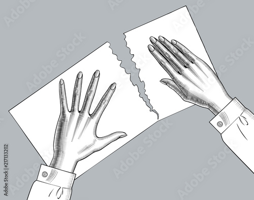 Female hands palms down tear a paper sheet