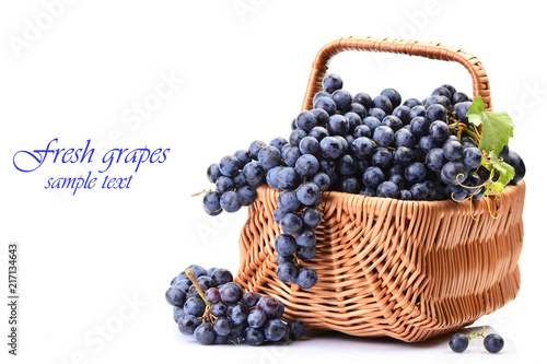 Basket of grapes on a white background