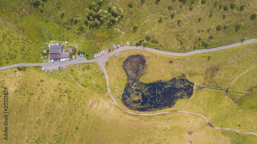 Schilpario, Bergamo, Italy. Drone aerial view of the lodge Vivione, the pond and the surroundings at the mountain pass photo