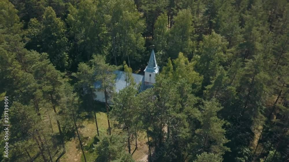 Small white church in forrest, drone 4k Small white church in forrest, drone 4k