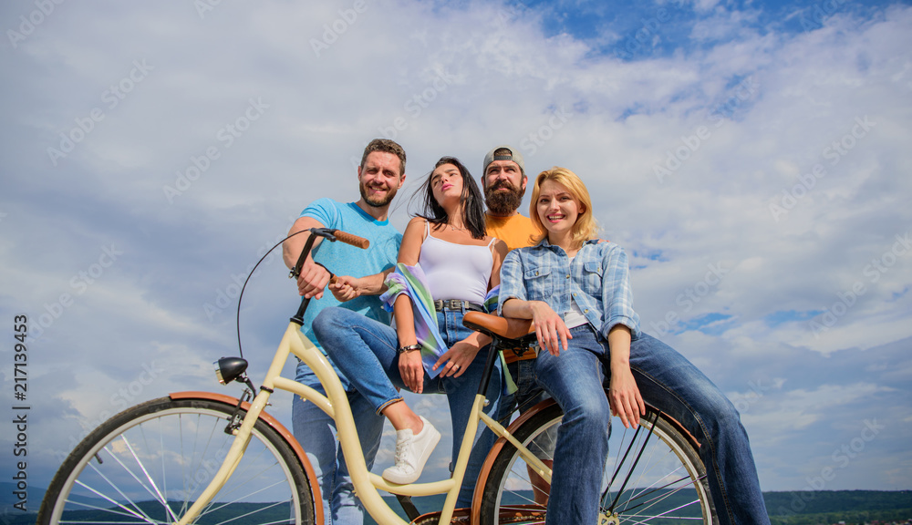 Group friends hang out with bicycle. Youth likes cruiser bike. Cycling modernity and national culture. Company stylish young people spend leisure outdoors sky background. Bicycle as best friend Group friends hang out with bicycle. Youth likes cruiser bike. Cycling modernity and national culture. Company stylish young people spend leisure outdoors sky background. Bicycle as best friend