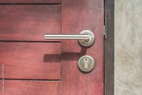 Wallpaper Mural Close up door handle on closed brown wooden door. (Selective focus) Torontodigital.ca