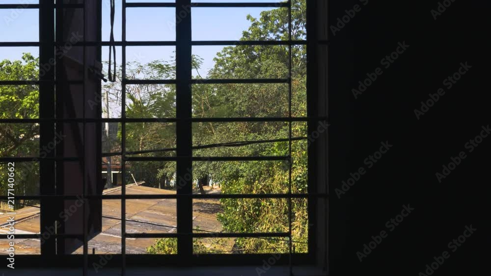 Steel bars on window frame looking out to rooftops
Panning from right to left inside abandoned building in Sylhet Steel bars on window frame looking out to rooftops
Panning from right to left inside abandoned building in Sylhet