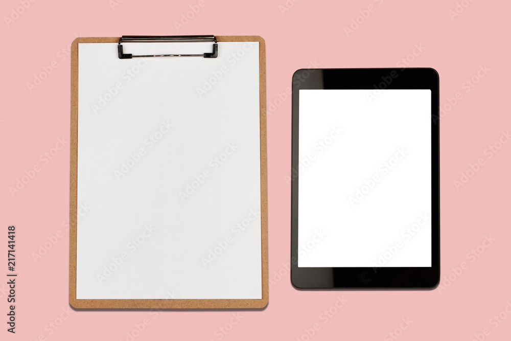 Digital tablet with blank screen and clipboard on pink background Digital tablet with blank screen and clipboard on pink background