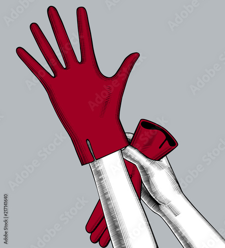 Female hands dressing red gloves