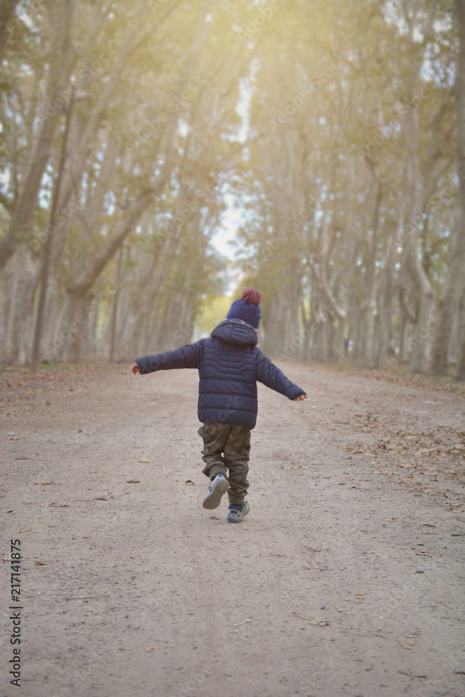 BACK CHILD RUNNING OR PLAYING PILOT AVIATOR ON NATURALL PARK ON AUTUMN BACK CHILD RUNNING OR PLAYING PILOT AVIATOR ON NATURALL PARK ON AUTUMN