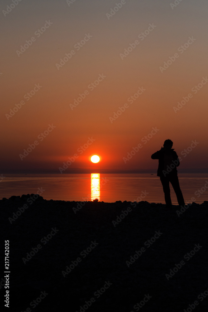silhouetted man on sunset background