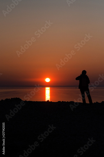 silhouetted man on sunset background