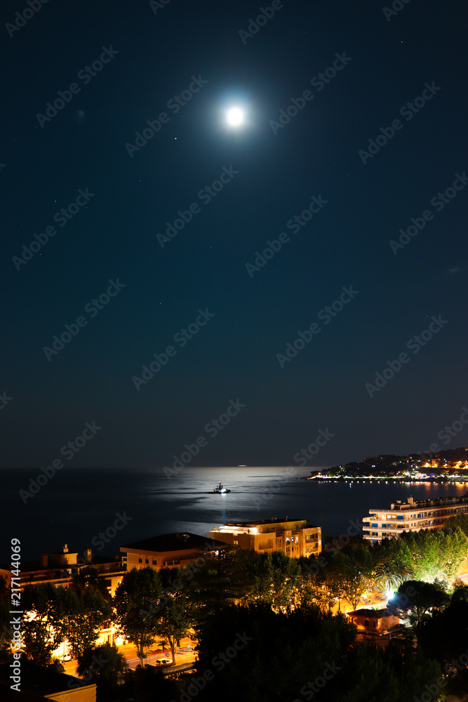 Fototapeta premium Moon in a dark night, Menton, France.