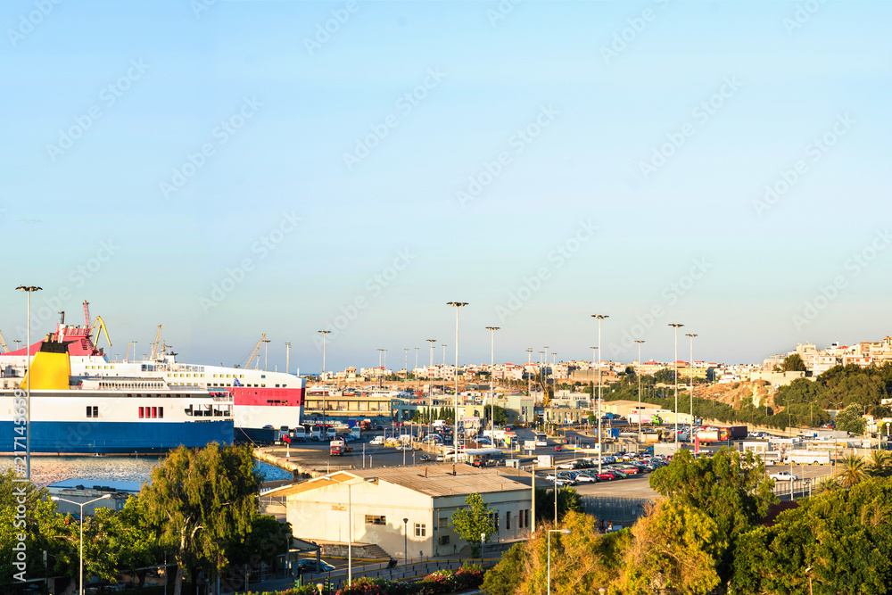 Banner of Heraklion harbour with old venetian fort Koules. Yachts and ferry boat on sunset in the port. Crete, Greece, 