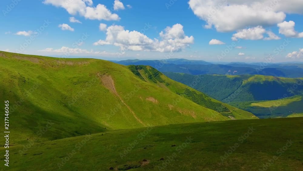 Aerial shot of two mountains with flat peaks in the Carpathians in summer Aerial shot of two mountains with flat peaks in the Carpathians in summer