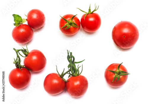 Tomatoes collection of whole and sliced with a branch of tomato leaf isolated on white background. Tasty and healthy food. Flat lay, top view