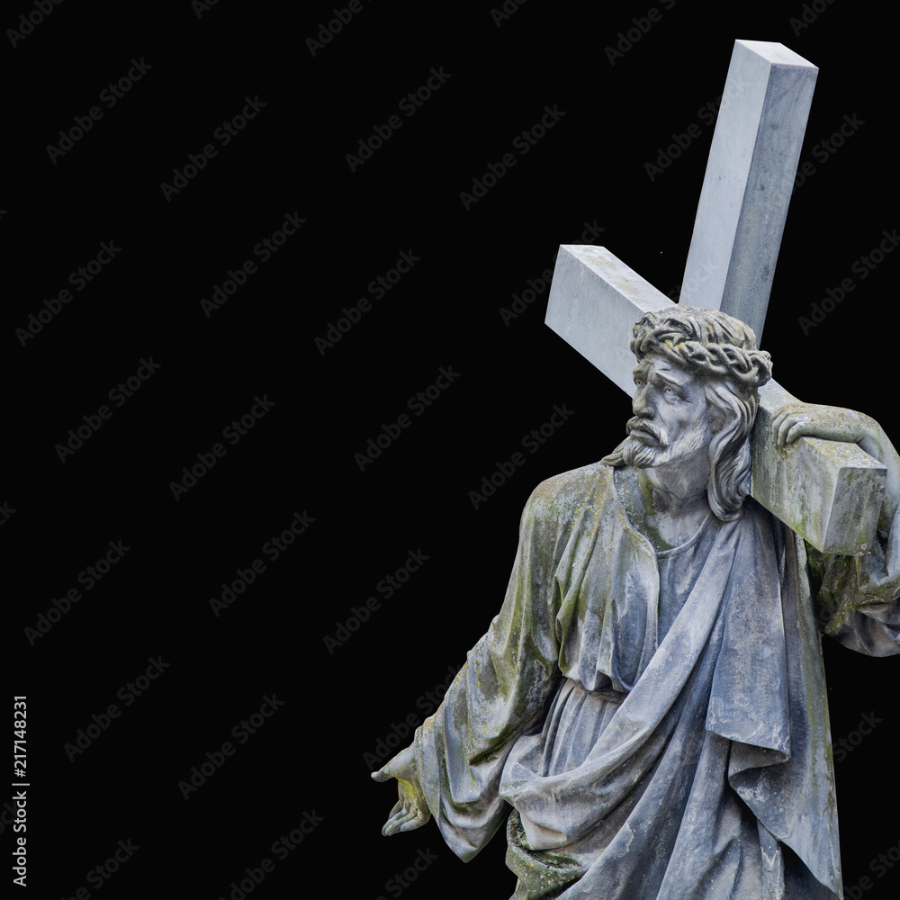 Obraz premium The road to Golgotha. Ancient statue of Jesus Christ with cross. (holy, faith, religion, God, suffering concept)
