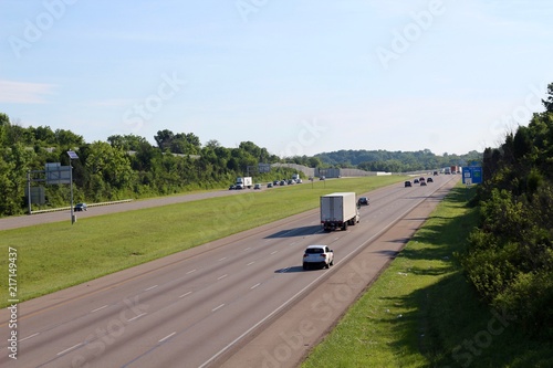 The busy interstate highway on a sunny summer morning.