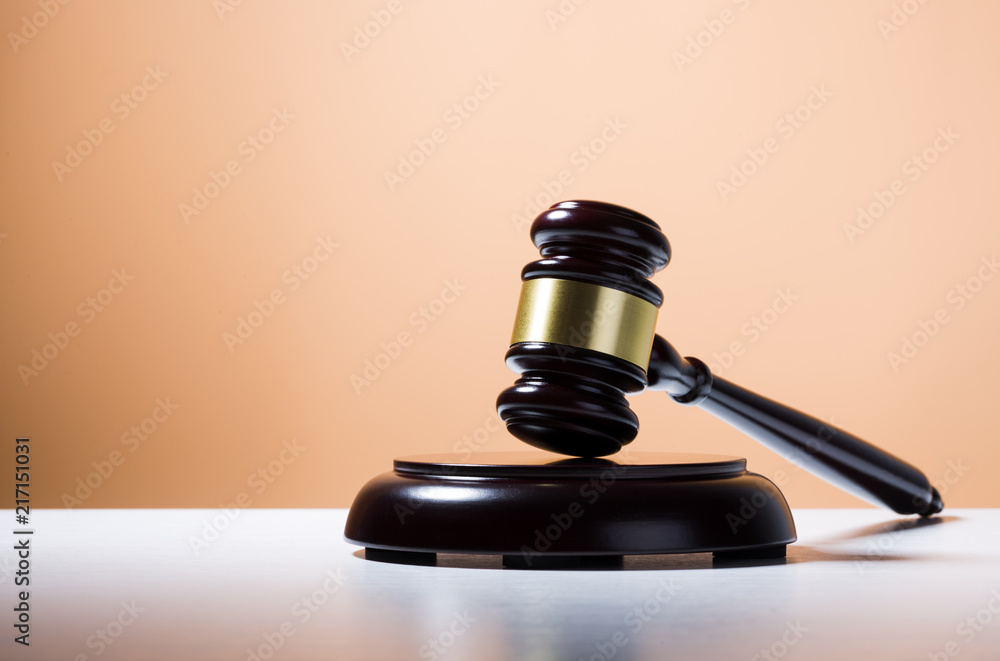 Judge hammer on table with color background Judge hammer on table with color background