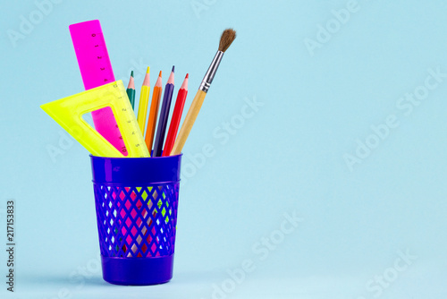 Stationery, school supplies on a blue background. School. Copy space.