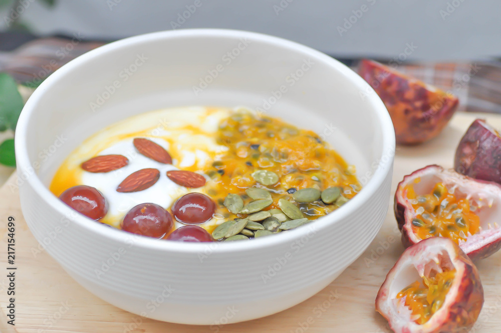 yogurt with passion fruit, almond and grape topping yogurt with passion fruit, almond and grape topping