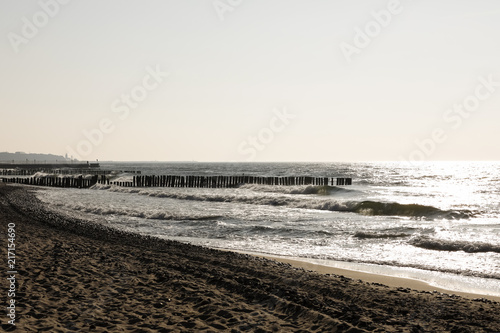 The sun slowly begins to set over the beach