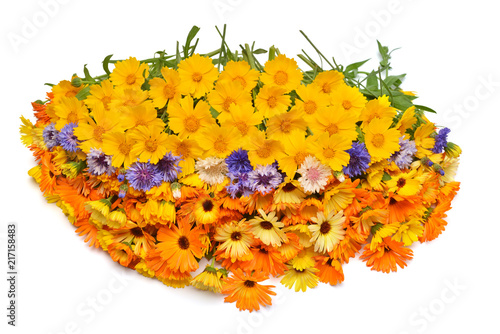 Bouquet is beautiful oval form with flowers of calendula, koreopsis and cornflowers. Yellow, orange and blue. Creative arrangement. Useful and medicinal herbs. Flat lay, top view