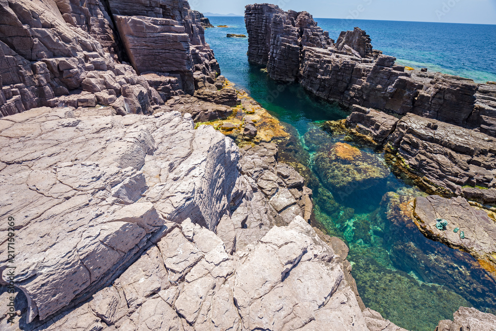 Rock formations on the cliffs of the island of San Pietro in Sardinia, Italy.