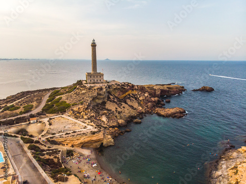 Lighthouse of Cabo de Palos, cape in the Spanish municipality of Cartagena, in the region of Murcia. Small spanish village, drone arial panoramic photo. Summer 2018 from drone photo