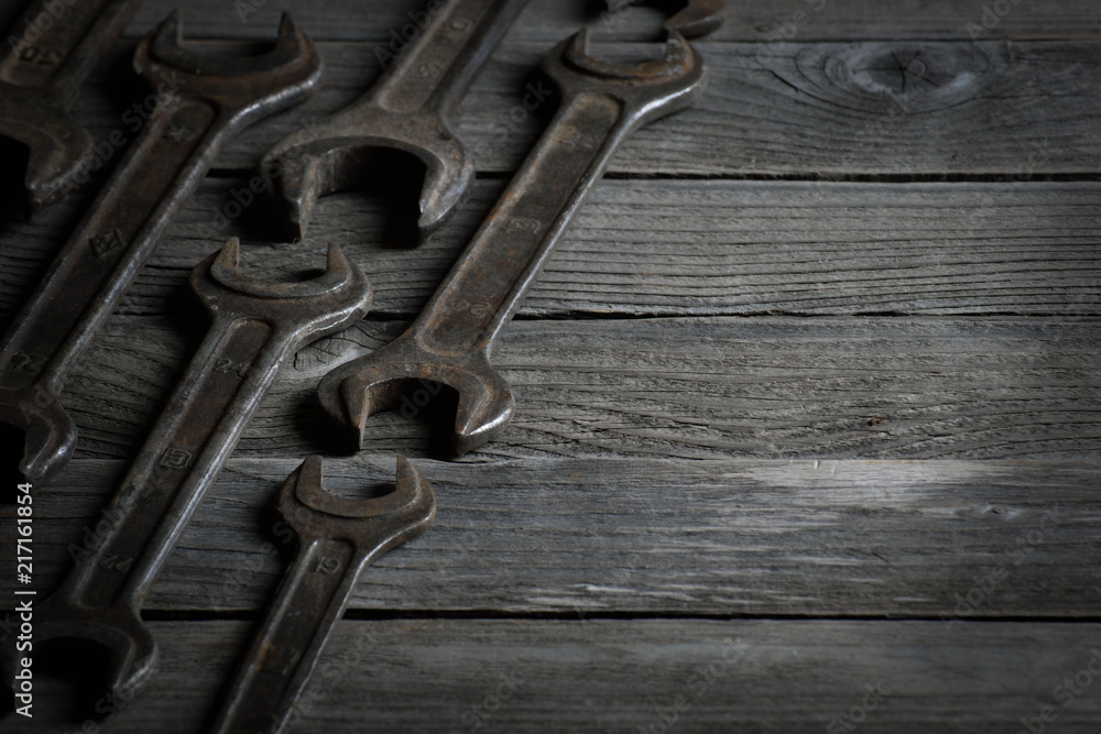 Dirty set of hand tools on a wooden background. Old rusty tools Dirty set of hand tools on a wooden background. Old rusty tools