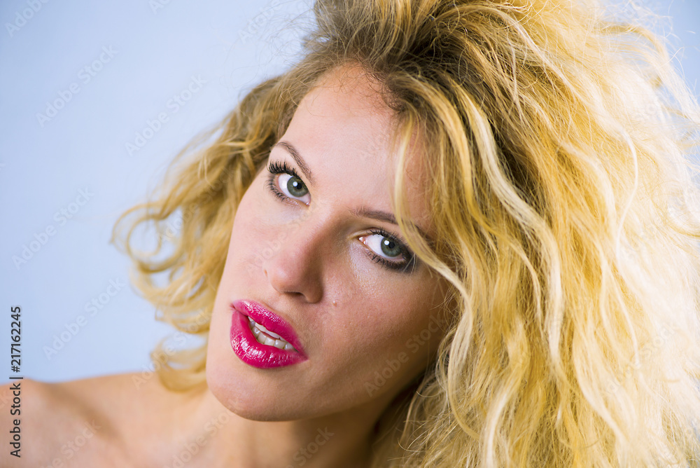 face of a pretty girl with curly hair and red lips closeup face of a pretty girl with curly hair and red lips closeup