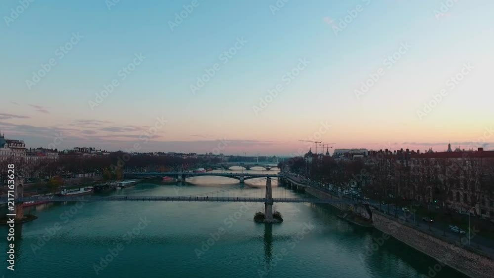 Drone shot over a French city at sunset. Drone shot over a French city at sunset.
