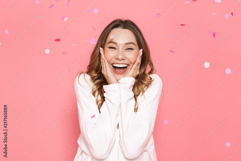 Portrait of an excited young woman celebrating - obrazy, fototapety, plakaty 