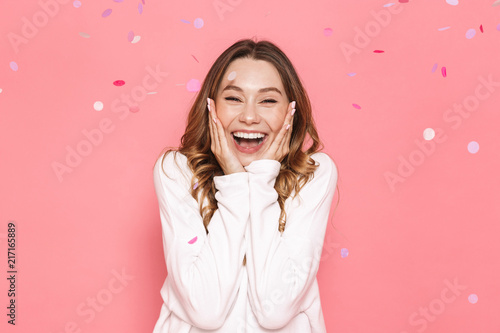 Portrait of an excited young woman celebrating photo