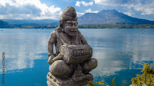Old statue in the middle of the Danau Batur, Bali Island in Indonesia photo