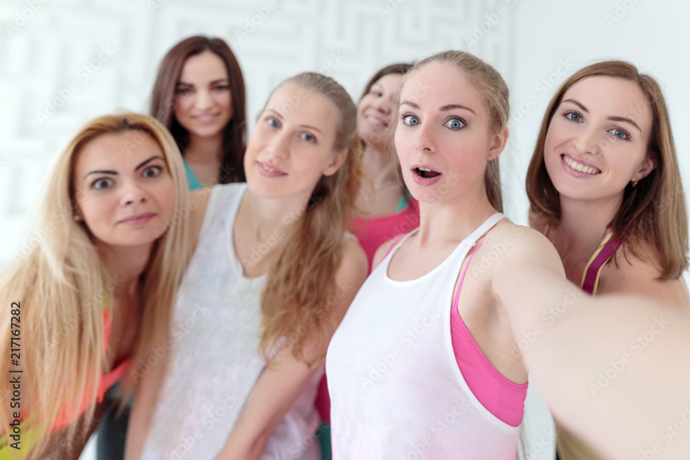 Young women taking a selfie at the fitness studio Young women taking a selfie at the fitness studio