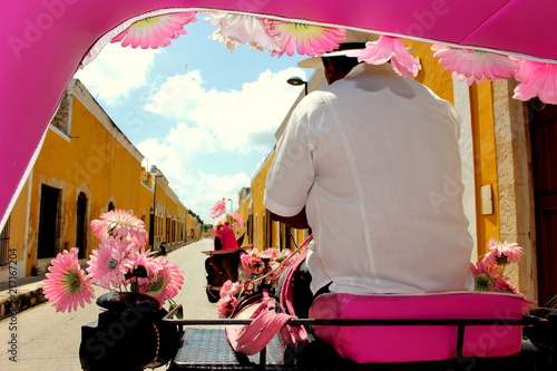 pink horse-drawn carriage in Izamal, Mexico photo