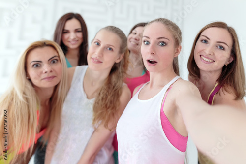Young women taking a selfie at the fitness studio