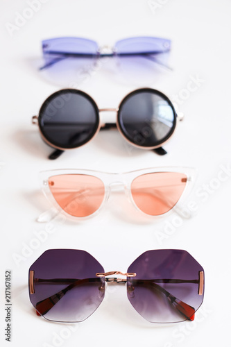 Various colorful stylish fashionable sunglasses, isolated on white background
