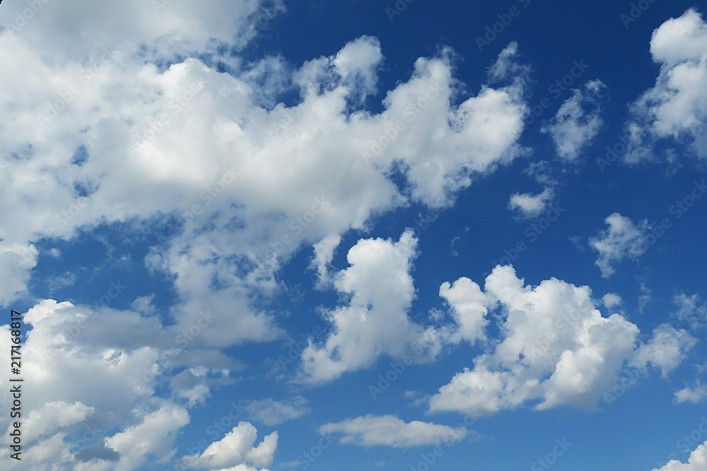 Beautiful fluffy clouds in blue sky, natural background Beautiful fluffy clouds in blue sky, natural background