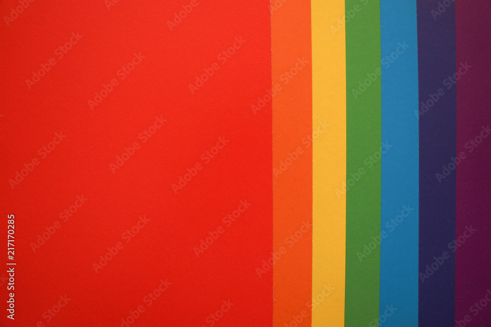 Obraz premium Rainbow flat lay background with color paper sheets.