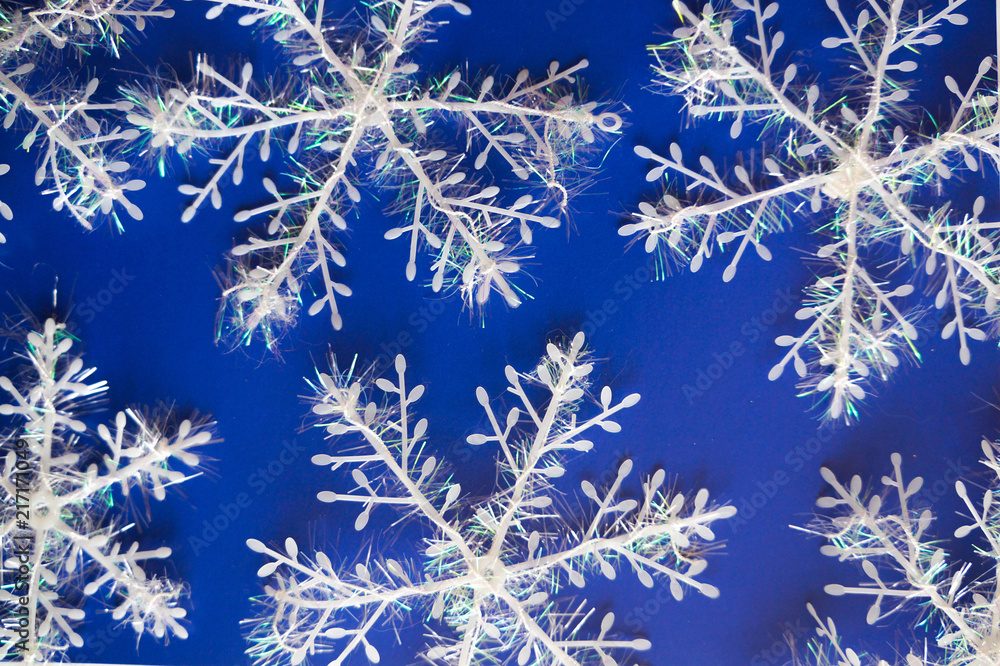 New Year's blue background with white snowflackes. New Year's blue background with white snowflackes.