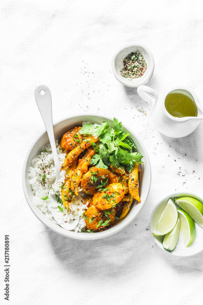 Potatoes and green beans curry sauce with rice and cilantro. Indian vegetarian healthy food on grey background, top view Potatoes and green beans curry sauce with rice and cilantro. Indian vegetarian healthy food on grey background, top view