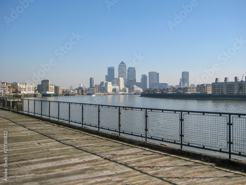 River Thames with Canary Wharf skyscrapers  in London  UK